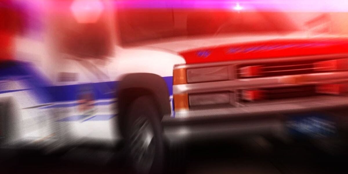 Woman rescued from being pinned underneath car, authorities say