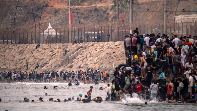 Migrants return to Morocco from the Spanish enclave of Ceuta, Friday, July 31, 2026.
