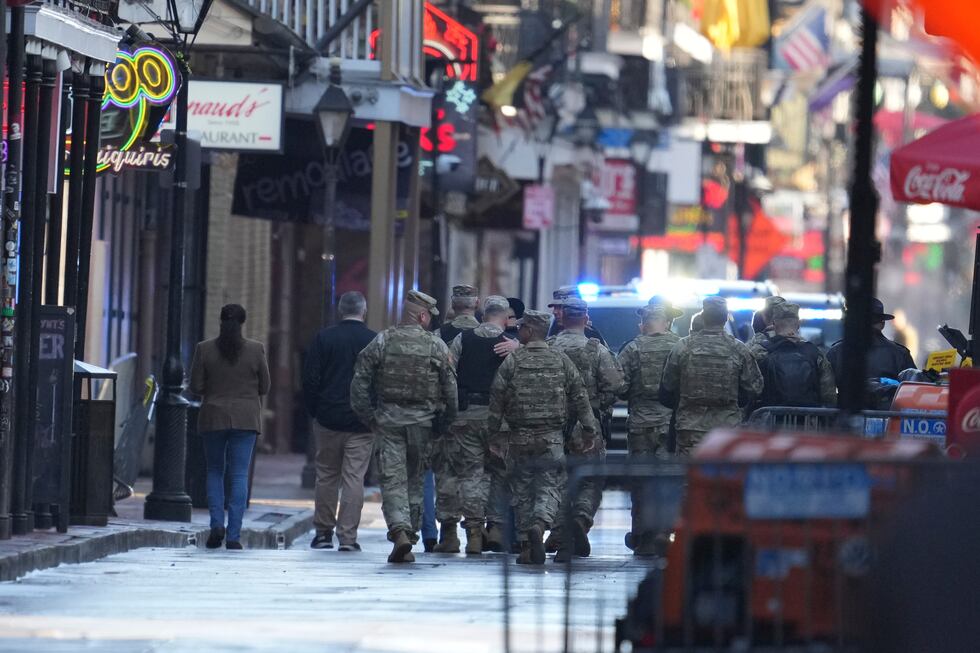 Military personnel walk down Bourbon street, Thursday, Jan. 2, 2025 in New Orleans. (AP...