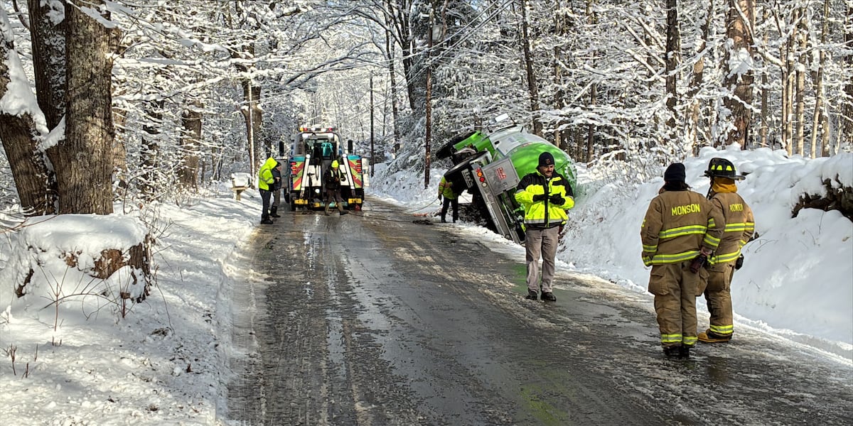 Oil truck overturned on the side of the road